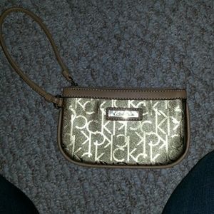 Calvin Klein shiny gold wristlet.