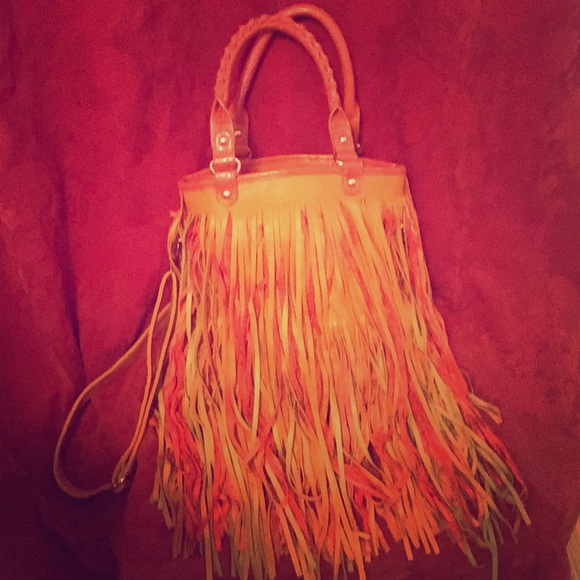 Orange leather fringe purse.