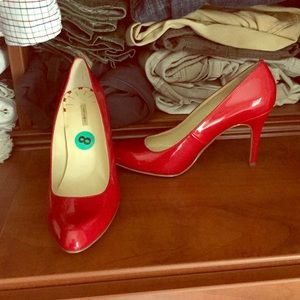 Red patent stilettos