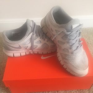 White and gray Nike gym shoes