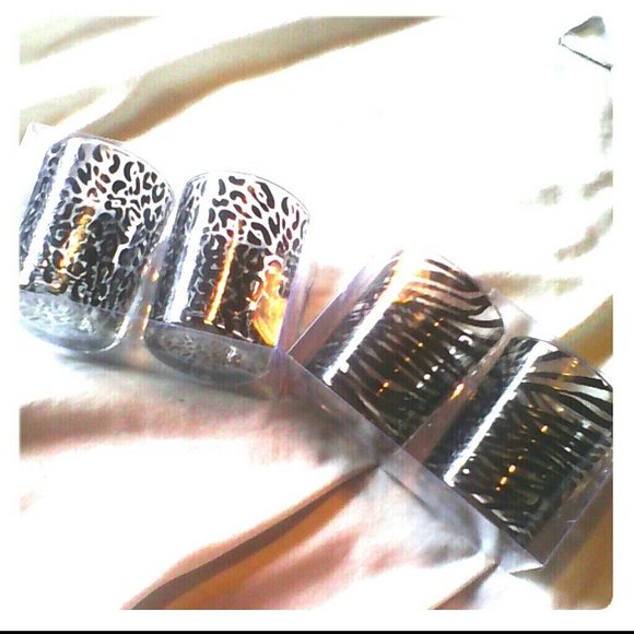 Two sets of two candles holders.