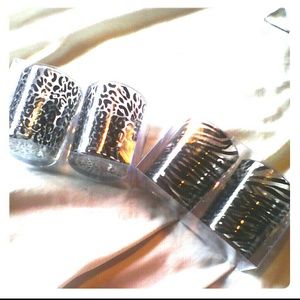 Two sets of two candles holders.