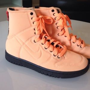 Orange Nike high tops.