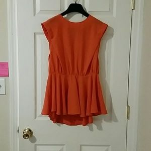 Peplum top with an opening in the back