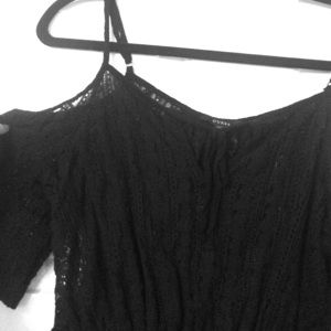 Black lace off-the-shoulder top by GUESS.