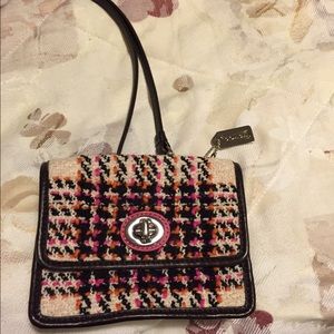 A small Coach cross body bag