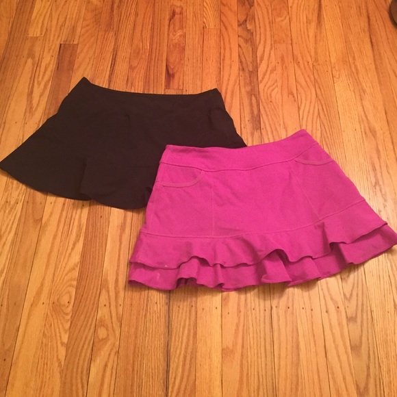 2 tennis skirts black Nike and Fuschia Zella