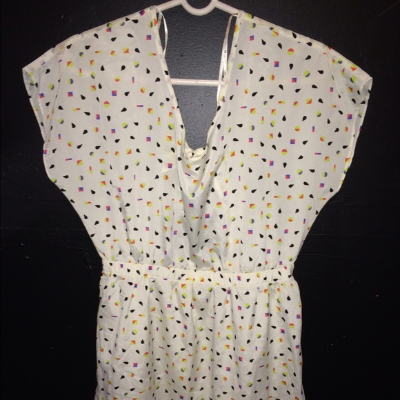 Creme dress with colorful shapes.