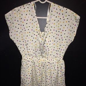 Creme dress with colorful shapes.