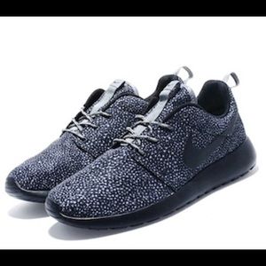 Black and Grey Nike roshe runs.