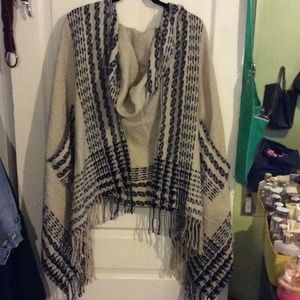 Tan and black hooded wrap poncho