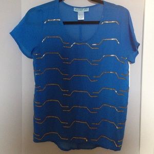 Blue shirt with gold beads