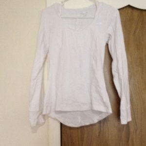 Hooded athletic top with thumb hole sleeves