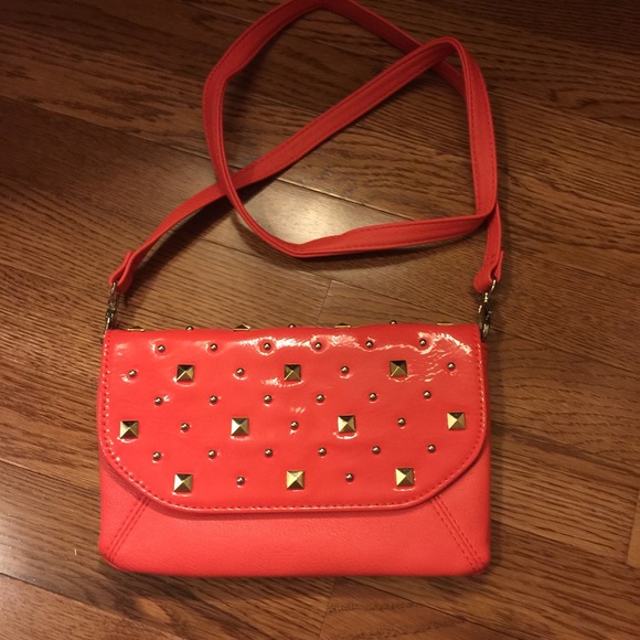 Grace Adele clutch. Coral color, with long strap.