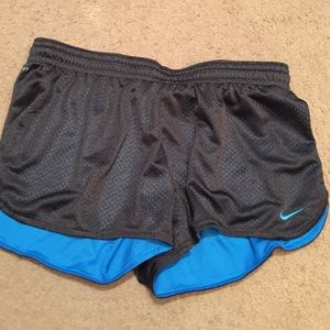 Blue and black Nike athletic shorts