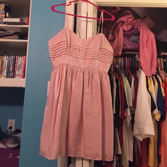A cute summer dress. The color is a shimmer pink