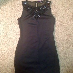 Black dress with sequined top design.