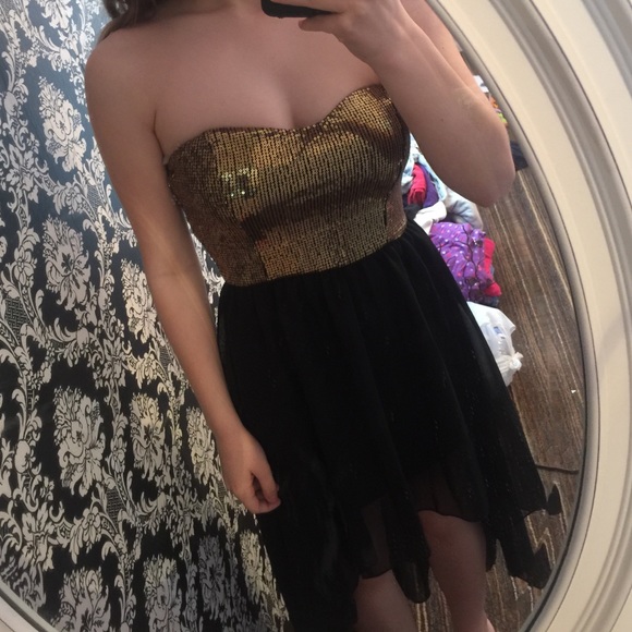 A gold and black high-low dress