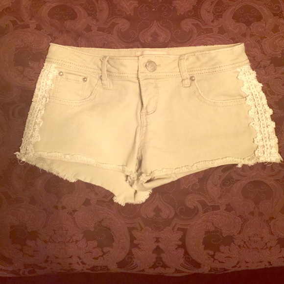 Khaki Almost Famous cutoff shorts with lace detail