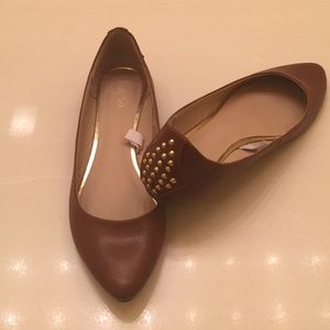 Brown flats with stud detail