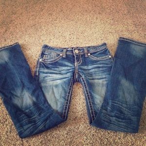 Distressed amethyst jeans