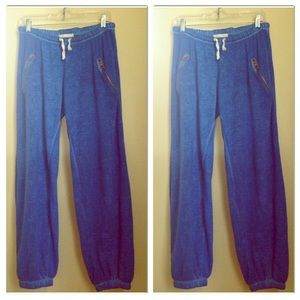 Bright blue sweats w/ zipper pockets & ankle cuffs