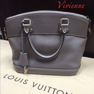 Authentic Louis Vuitton Suhali with locket