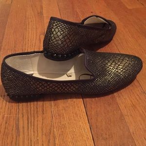 Black and gold flats with studded heel