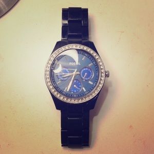 Fossil black watch with blue face.