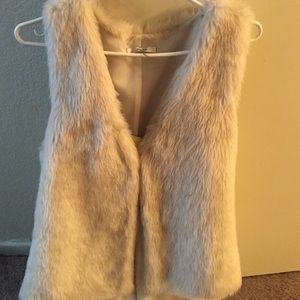White fur vest