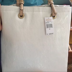 Brand new white Michael Kors purse.