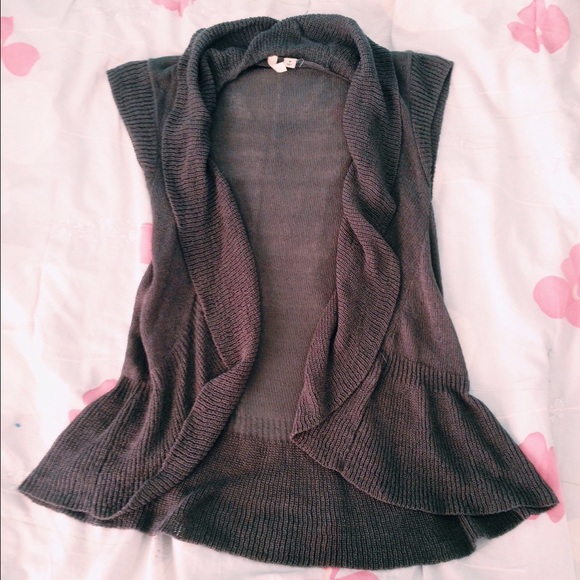 Grey sleeveless vest.