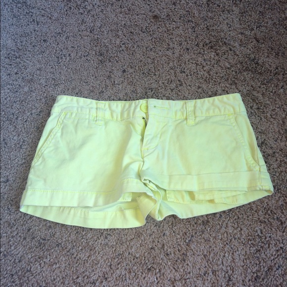 Pastel yellow shorts.