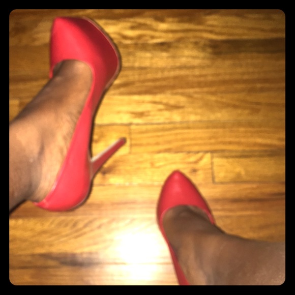 Red leather pumps