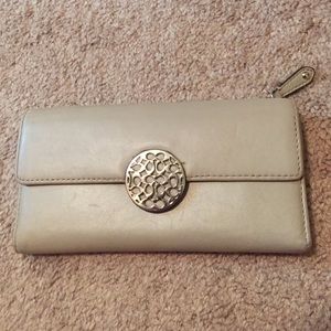 Light tan leather Coach wallet