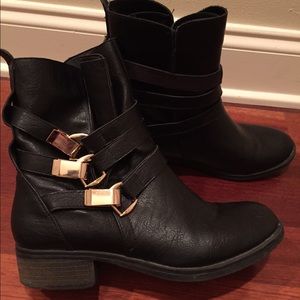 Like new black bootie with gold hardware