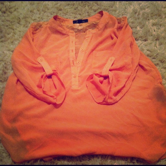 peach colored top with a lace back