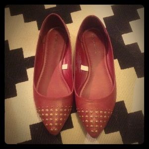 Red studded pointy toe flats