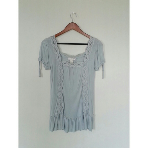 Light blue top with lace details.