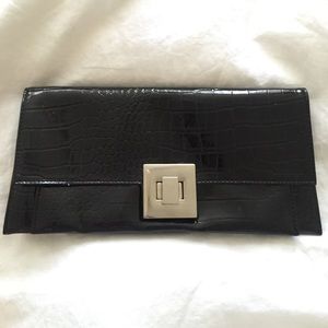 Black patent leather clutch with silver accents