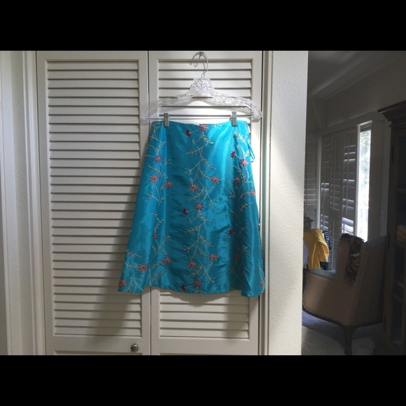 Turquoise silk embroidered skirt.