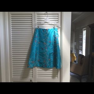 Turquoise silk embroidered skirt.