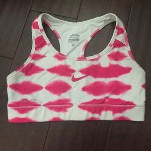 Pink and white Nike sports bra