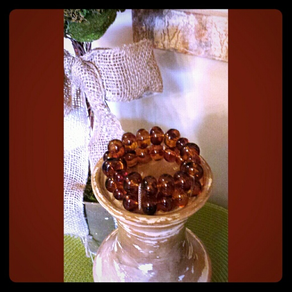 Brown cuff  beaded bracelet with gold accents.