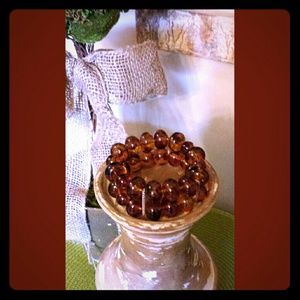 Brown cuff  beaded bracelet with gold accents.