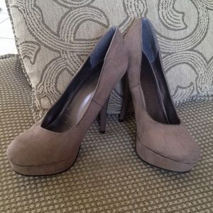 Heels with 4 3/4 inch a brown unique type color.