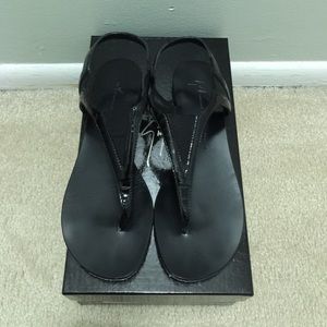 Giuseppe Zanotti flat thong sandal in black.