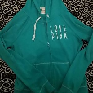 Pink sweatshirt in teal