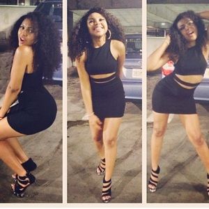 Mini black dress with midriff split