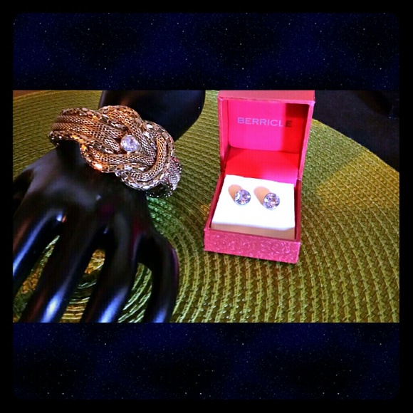 Stunning gold bracelet and gold stud earrings.